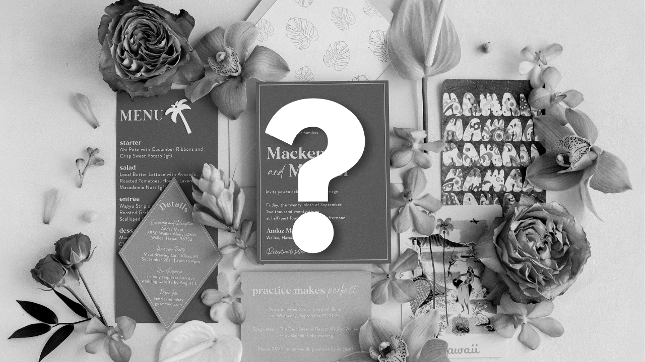 A black and white image of an invitation suite.  In the middle of the photo is a large "?".