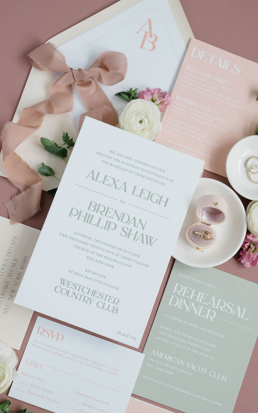 Wedding invitation with floral decorations on a pink surface