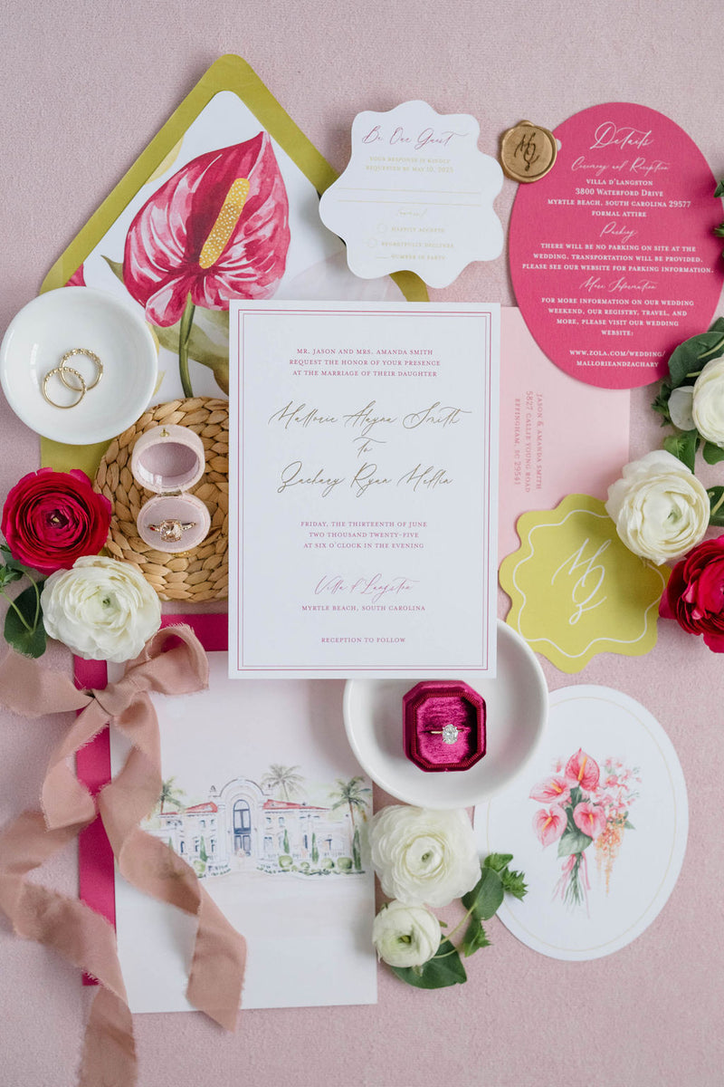 Wedding invitation set with floral elements on a pink background